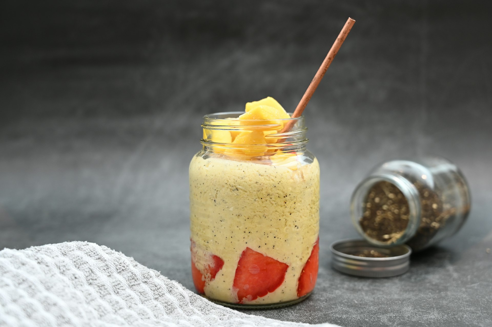 a jar of food with a straw sticking out of it